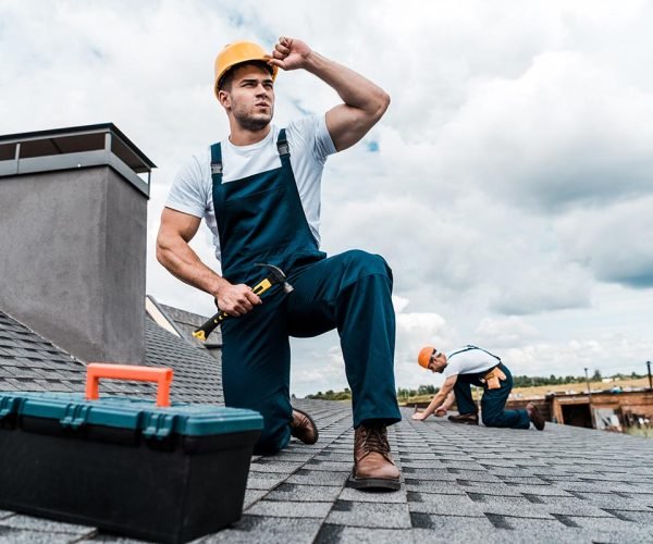 selective-focus-of-handsome-handyman-touching-helm-resize.jpg